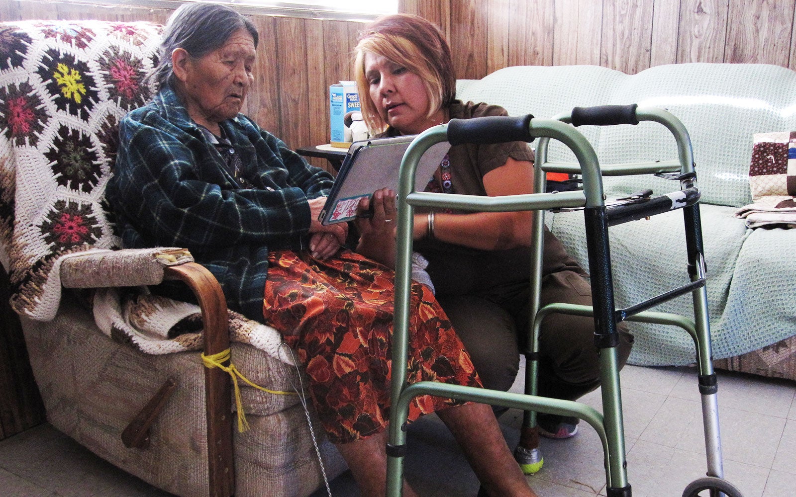 In visits to residents’ homes, community heath representatives provide health education and basic healthcare services. (Courtesy of COPE)