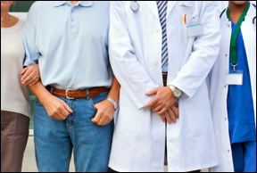 A doctor with other people standing together